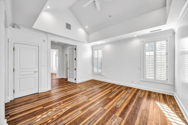 empty room featuring ceiling fan, ornamental molding, plenty of natural light, and dark hardwood / wood-style flooring