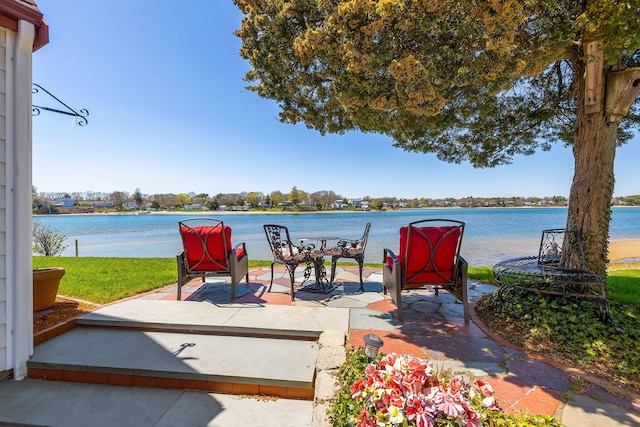 view of patio with a water view