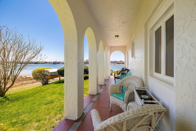 view of patio / terrace with a water view