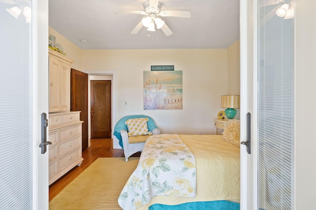 bedroom with ceiling fan and wood finished floors
