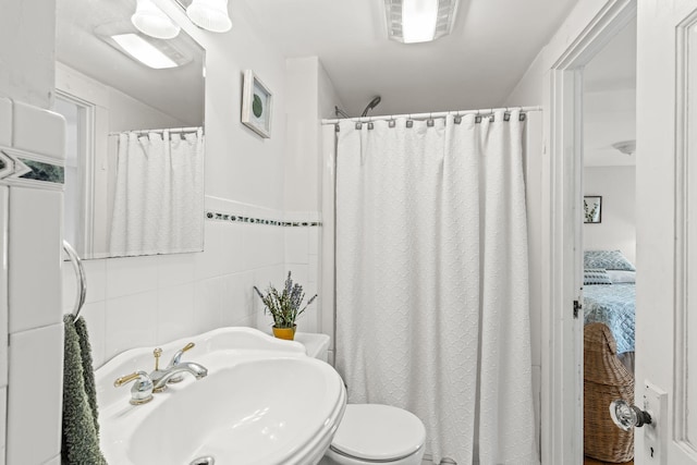 248 N Falmouth Hwy, North Falmouth, MA 02556 - full bathroom with a sink, toilet, tile walls, visible vents, and washer / clothes dryer