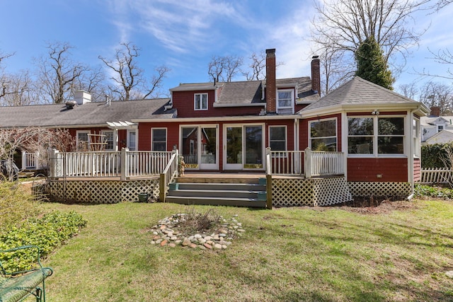 248 N Falmouth Hwy, North Falmouth, MA 02556 - back of house with a lawn, a chimney, a sunroom, and a deck
