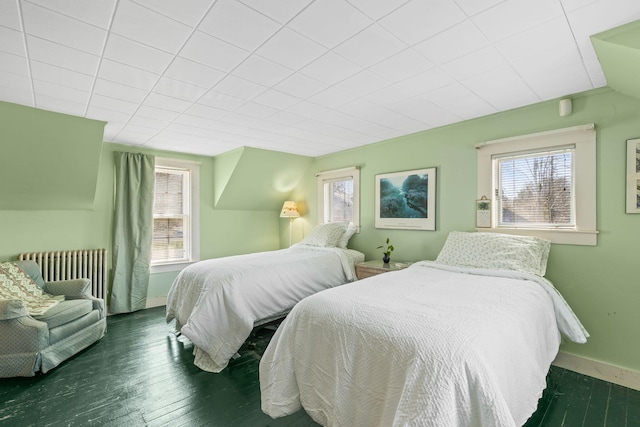 248 N Falmouth Hwy, North Falmouth, MA 02556 - bedroom featuring baseboards, radiator heating unit, wood finished floors, and multiple windows