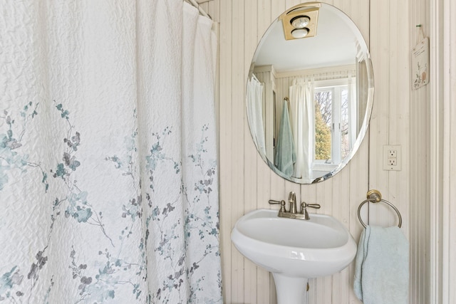 248 N Falmouth Hwy, North Falmouth, MA 02556 - bathroom with wood walls and a sink