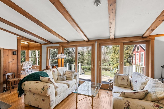 248 N Falmouth Hwy, North Falmouth, MA 02556 - living area featuring lofted ceiling with beams, plenty of natural light, and light wood-style flooring