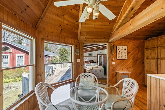 248 N Falmouth Hwy, North Falmouth, MA 02556 - interior space featuring vaulted ceiling with beams, a ceiling fan, wood walls, wood finished floors, and wooden ceiling