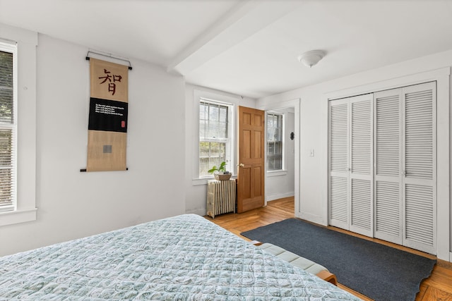 248 N Falmouth Hwy, North Falmouth, MA 02556 - bedroom featuring radiator heating unit, a closet, and wood finished floors
