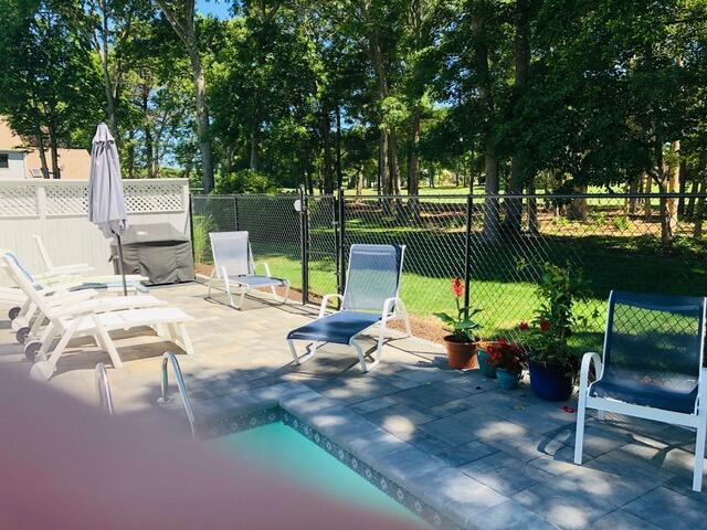 view of patio featuring fence