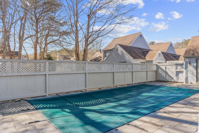 view of pool with a patio area and a fenced backyard