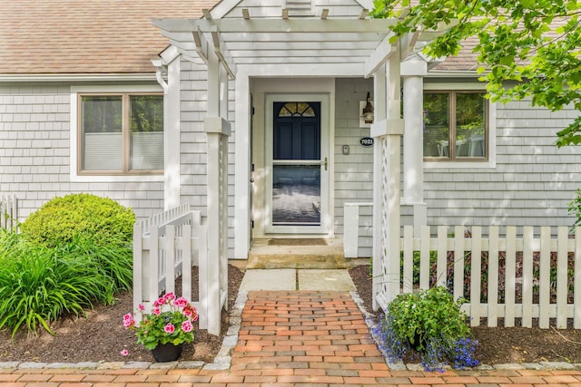 100 Mid-Iron Way Unit 7021, Mashpee, MA 02649 - view of front of house featuring a fenced front yard and roof with shingles