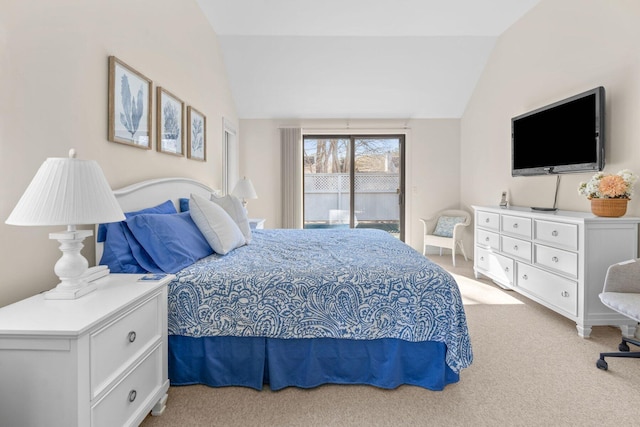 bedroom with light carpet, access to outside, and vaulted ceiling