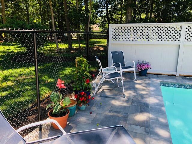 view of patio featuring fence