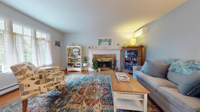 living room featuring wood-type flooring, a wall mounted AC, and baseboard heating