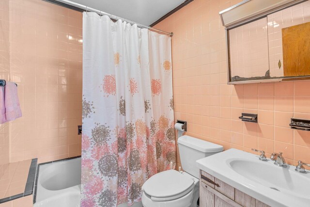 11 Joe Lincoln Rd, West Harwich, MA 02671 - bathroom featuring tasteful backsplash, toilet, tile walls, and shower / bath combo
