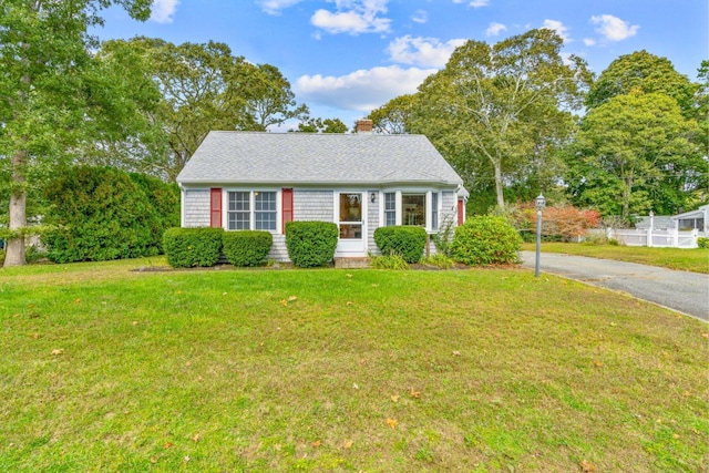 11 Joe Lincoln Rd, West Harwich, MA 02671 - view of front of property featuring a front lawn, aphalt driveway, and a chimney
