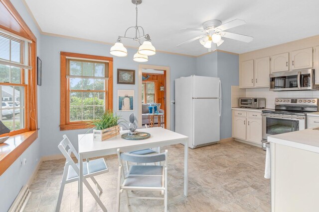 11 Joe Lincoln Rd, West Harwich, MA 02671 - kitchen with baseboards, ornamental molding, decorative backsplash, light countertops, and stainless steel appliances