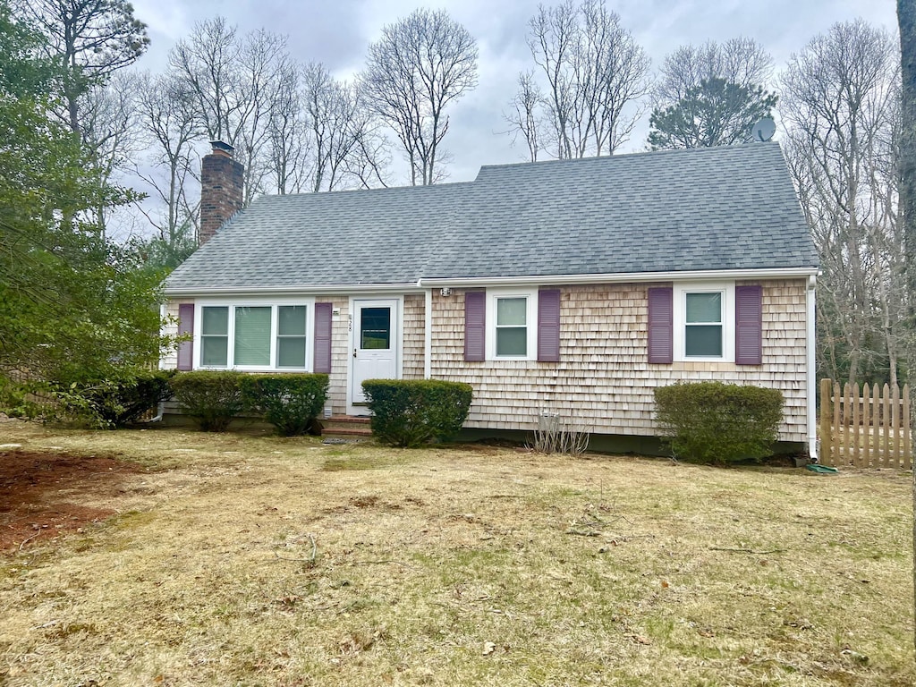 28 Shepard Pl, East Falmouth, MA 02536 - view of front of property with a chimney and a shingled roof