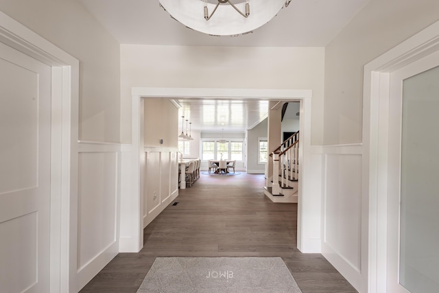 corridor with dark wood-type flooring