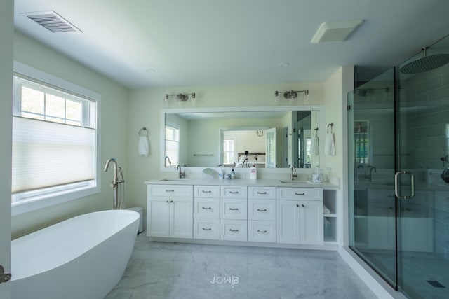 bathroom with vanity and plus walk in shower