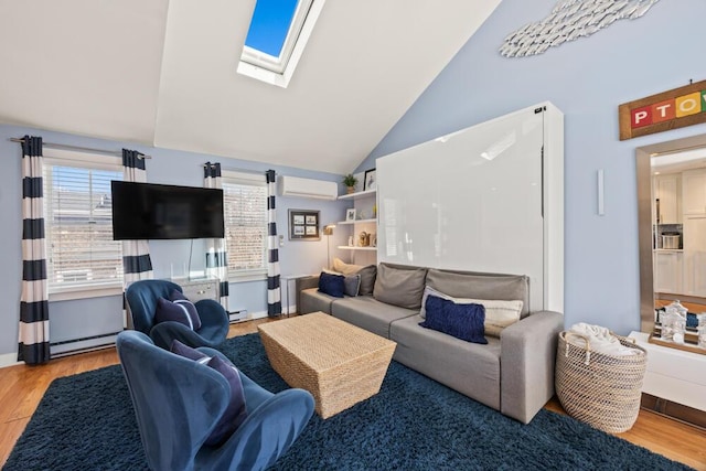 living room with a baseboard heating unit, a wall mounted AC, wood finished floors, and vaulted ceiling with skylight