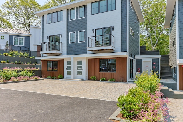 50 Nelson Ave Unit 4, Provincetown, MA 02657 - view of front facade with a balcony and board and batten siding