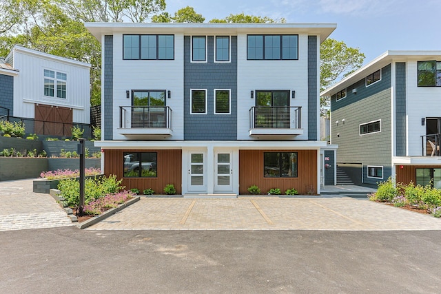50 Nelson Ave Unit 4, Provincetown, MA 02657 - view of front of home with a balcony, uncovered parking, and board and batten siding