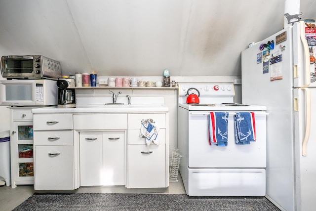 kitchen featuring white cabinetry and white appliances