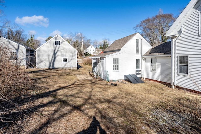 rear view of house with a lawn