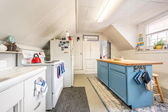 kitchen featuring blue cabinets, lofted ceiling, butcher block counters, and white appliances