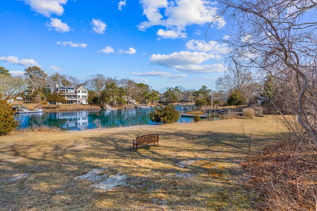 exterior space featuring a yard and a water view