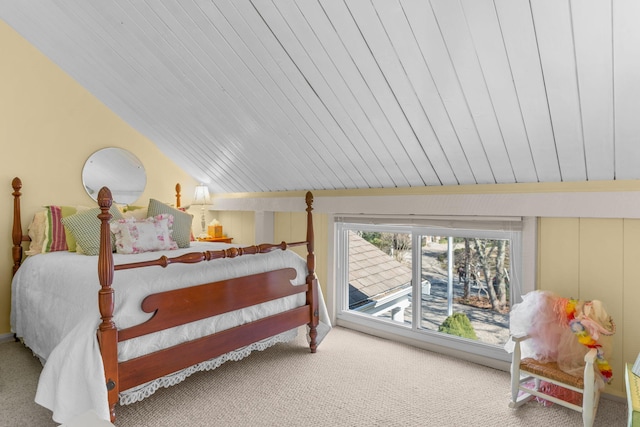 carpeted bedroom featuring vaulted ceiling and access to outside