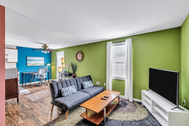 living room with ceiling fan and wood-type flooring