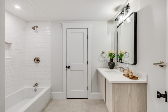 full bathroom featuring tile patterned floors, shower / tub combination, baseboards, and vanity