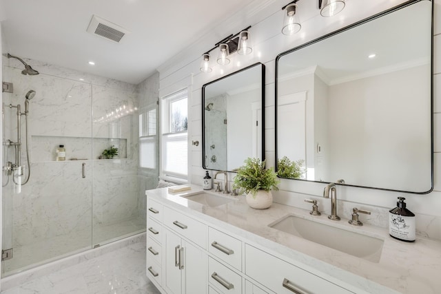 full bathroom with marble finish floor, ornamental molding, a sink, and a marble finish shower