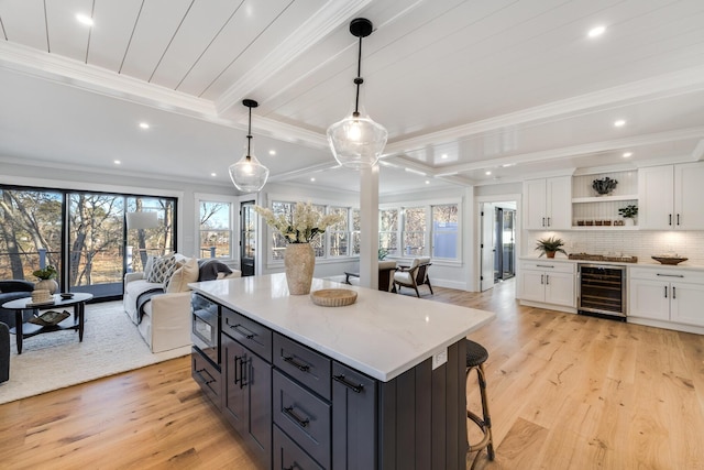 kitchen with wine cooler, light wood-style flooring, white cabinetry, open floor plan, and open shelves