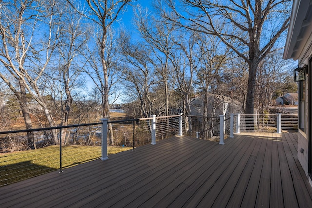 wooden deck with a lawn