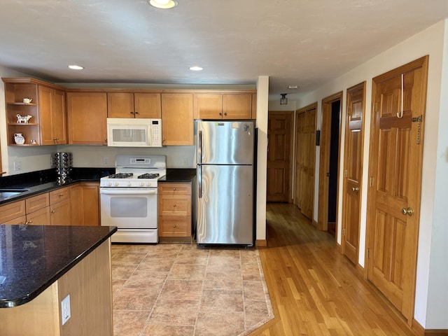 kitchen with white appliances, recessed lighting, open shelves, and light wood-type flooring