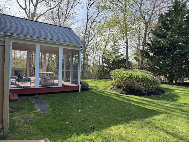 view of yard with a sunroom