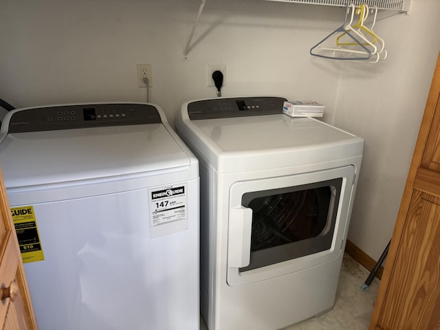 laundry room featuring independent washer and dryer and laundry area