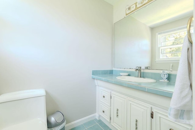 37 Old Salem Way, Osterville, MA 02655 - half bathroom featuring tile patterned flooring, baseboards, vanity, and toilet