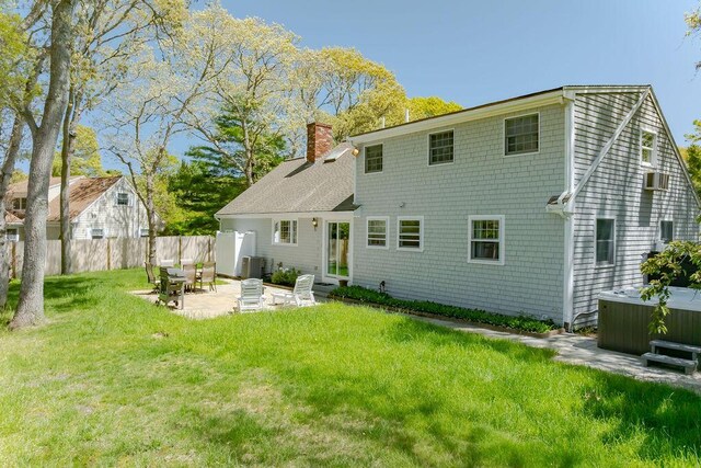 37 Old Salem Way, Osterville, MA 02655 - back of house featuring a hot tub, a patio area, a chimney, and cooling unit