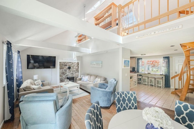 37 Old Salem Way, Osterville, MA 02655 - living area with a high ceiling, wood finished floors, a fireplace, and stairway