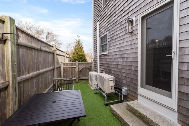 view of yard featuring ac unit and a fenced backyard