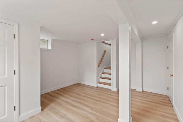 basement featuring light wood finished floors, stairway, recessed lighting, and baseboards