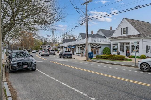 view of road featuring sidewalks and curbs