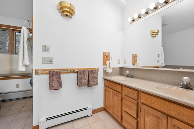 bathroom featuring tile patterned flooring, vanity, and baseboard heating