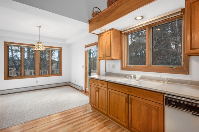 kitchen featuring sink, hanging light fixtures, baseboard heating, dishwasher, and light hardwood / wood-style floors