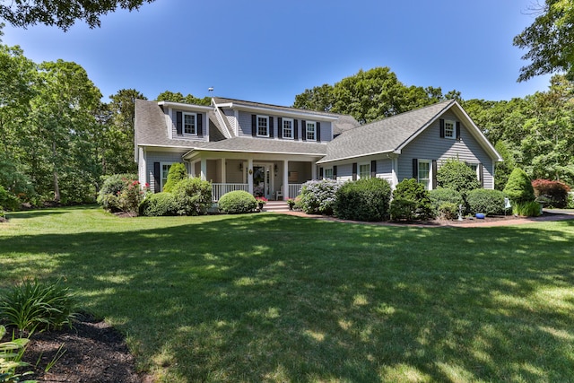 view of front facade featuring a front yard and a porch