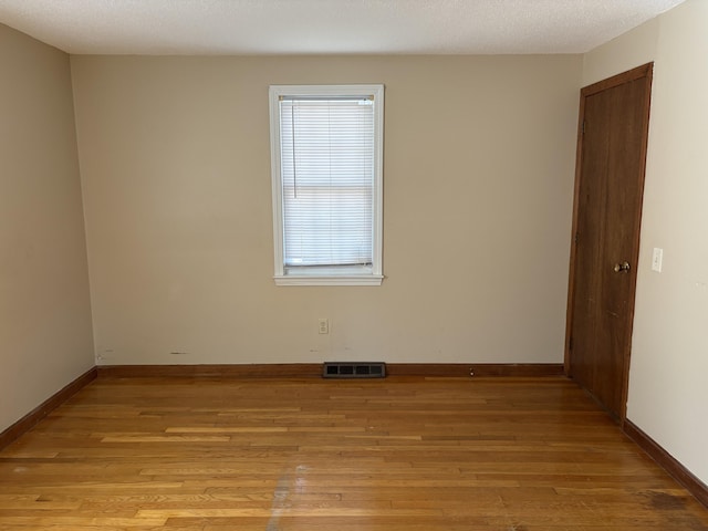 18 Russo Rd, West Yarmouth, MA 02673 - empty room with visible vents, baseboards, and light wood-style floors