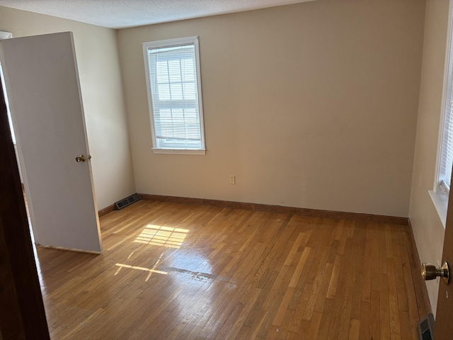 18 Russo Rd, West Yarmouth, MA 02673 - unfurnished room featuring visible vents, baseboards, and wood-type flooring